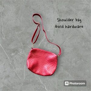 Red faux Ostrich leather shoulder bag. Gold hardware.